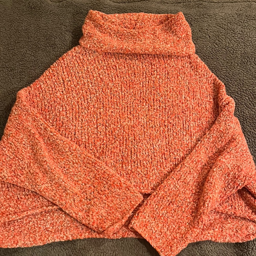 Pink speckled turtleneck sweater